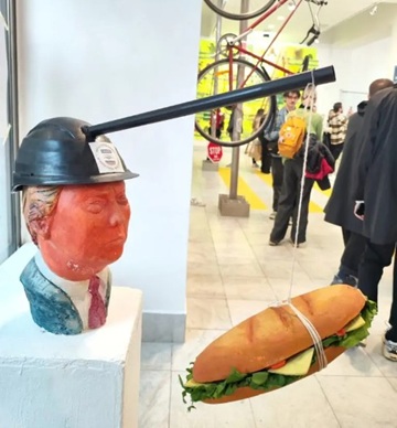 Student artwork showing image of pro-regime supporter being bribed with an "Index sandwich"