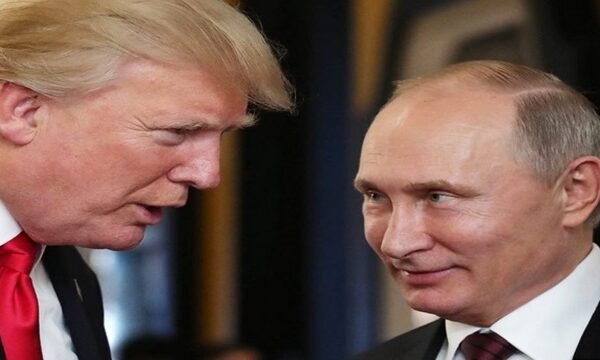 Trump looking down on a grinning Putin