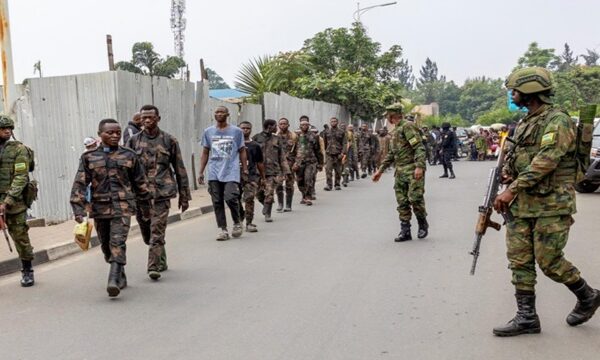 M23 troops escort captured soldiers