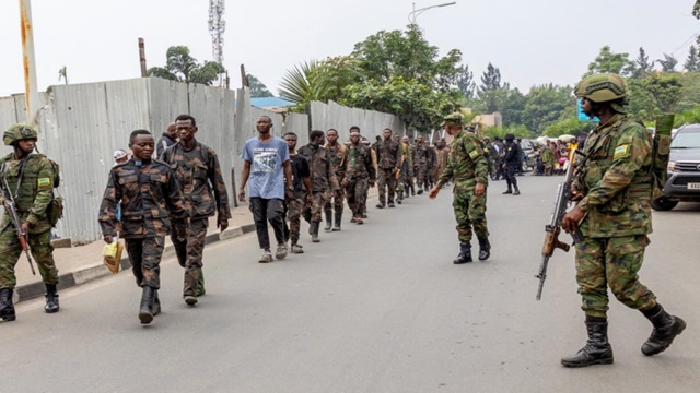 M23 troops escort captured soldiers