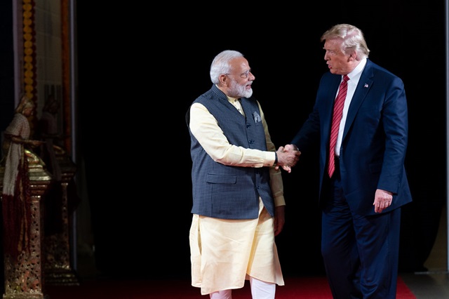 Modi and Trump meet with handshake