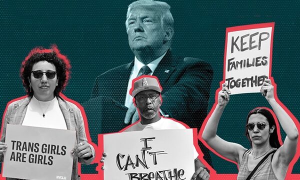Trump looms over protesters with placrds