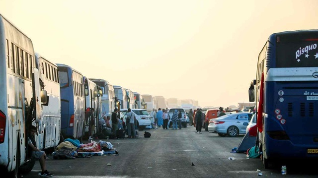 Caravan currently waiting permission to proceed as it waits in the Libyan desert