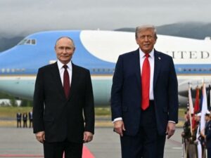 Trump and Putin walk along red carpet after meeting in Alaska