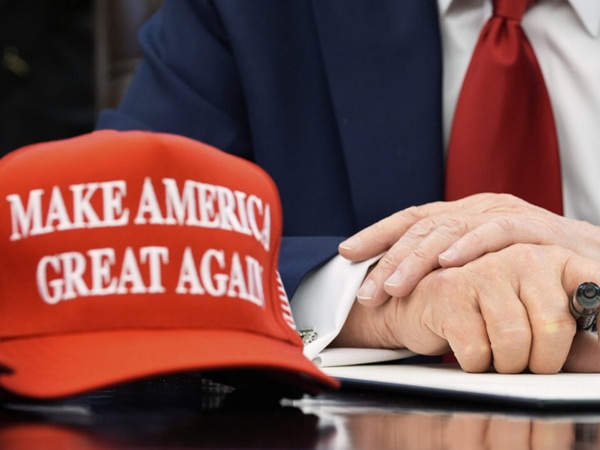 MAGA cap and Trump's hands