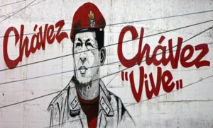 Graffiti of Chavez with text Chavez Vive