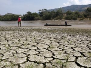 Fisherman Gabriel Barreto stands on the shore of the Magdalena river, the longest and most important river in Colombia,