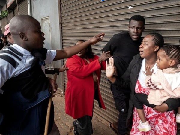 Thugs threaten immigrant family